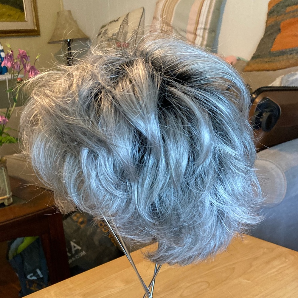 Woman’s wig gray with black.